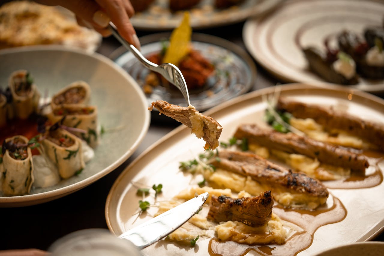 The Art of Drawing Readers In: Your attractive post title goes here Close-up of a gourmet meal with diverse dishes, showcasing fine dining and sophisticated presentation.